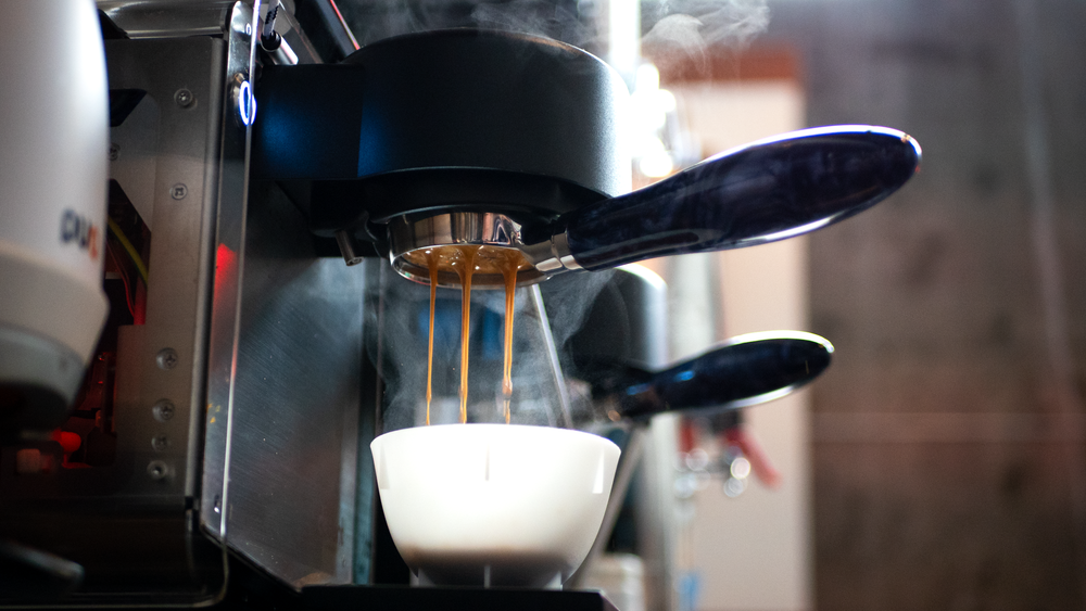 Espresso pouring into a cup at Naomi Joe